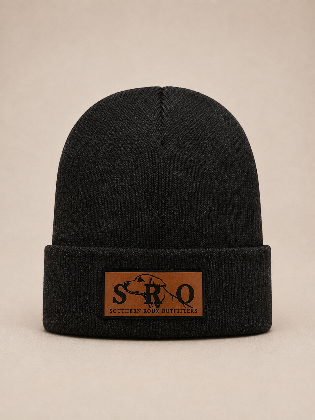Black knit beanie with a brown leather SRO patch on the cuff.