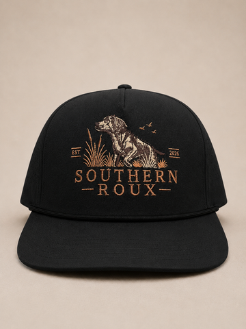 Black five-panel Southern Roux cap with embroidered dog-and-marsh logo.