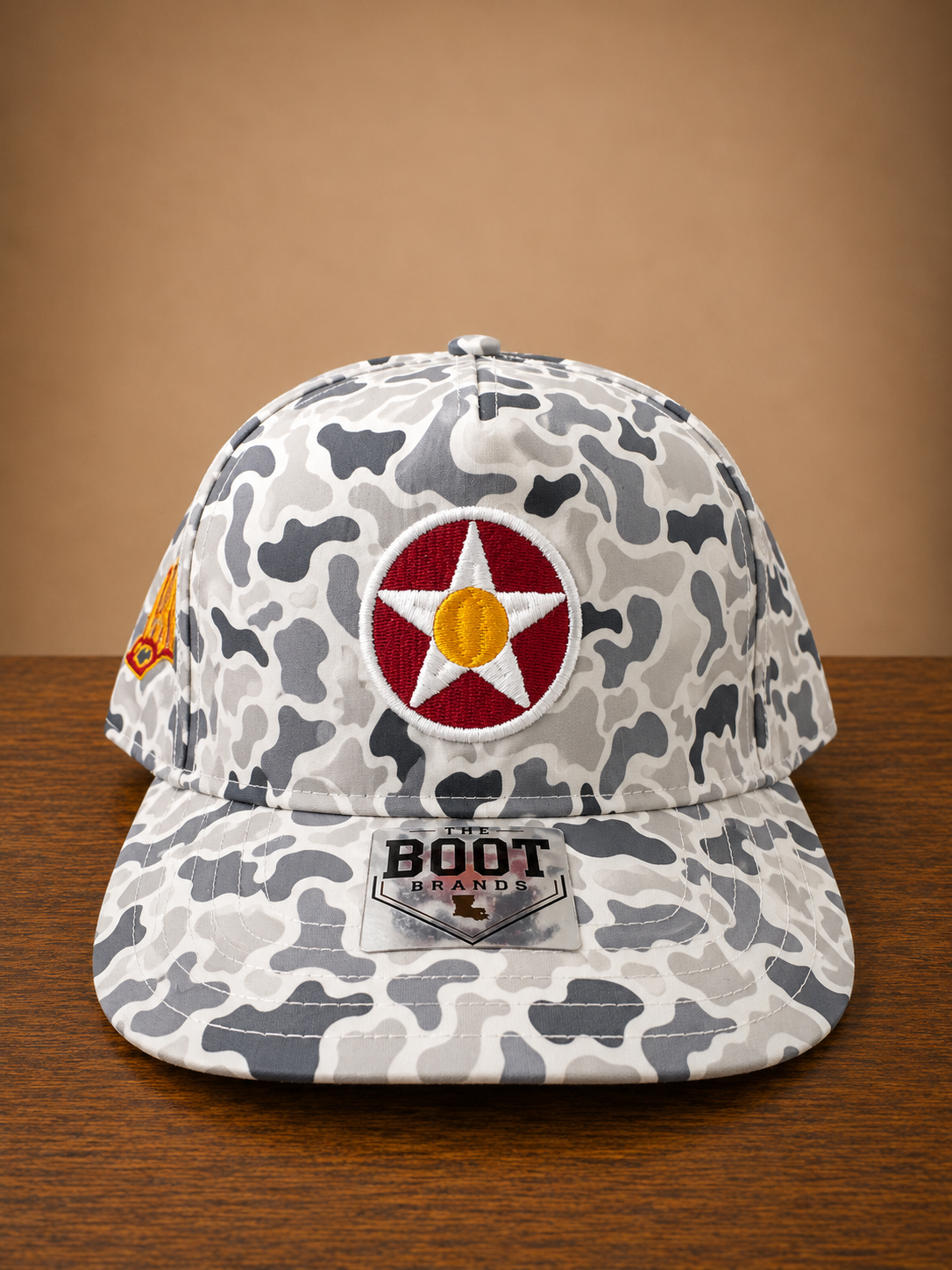 Smoke Gray Camo rope cap with a circular star design on front and ULM embroidery on the side.