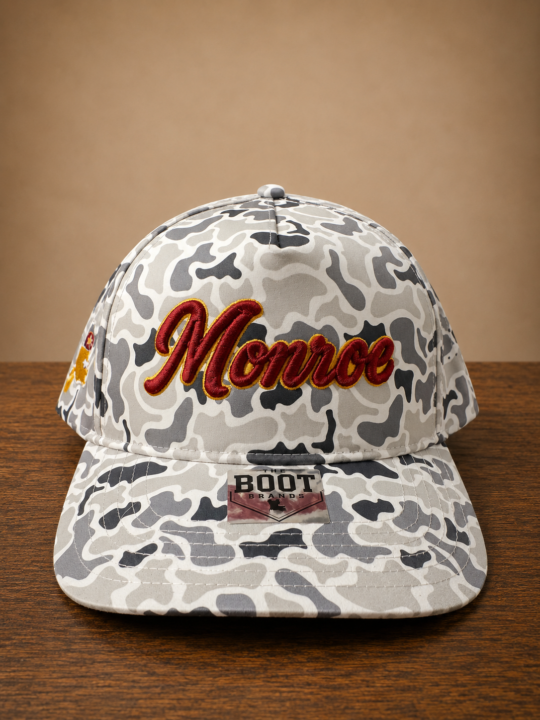 Smoke Gray Camo rope cap with Monroe script embroidery on front and Louisiana state embroidery on the side.